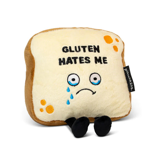 Gluten Hates Me Plush , Plush in the shape of a slice of bread, on it a sad face with tears  with the words "Gluten Hates Me"