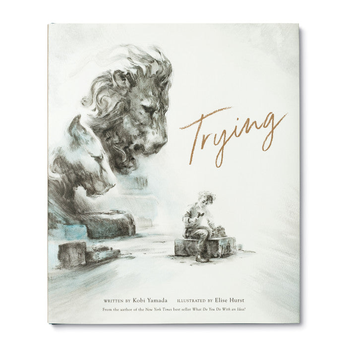 Front of book cover , boy sitting on box sculpting with images of  a lion and lioness hovering over him